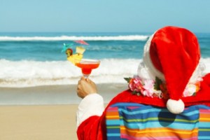 After a job well done, without mis-haps or omissions, Santa can enjoy some beach-time. Watch that little umbrella, Santa!