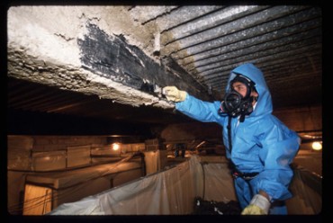 Bringing asbestos remediation in-house has meant training and special equipment for Construction ND, but it has been worth it.