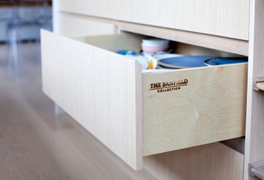 Bespoke drawers are usually solid wood, semi-custom are often not. IKEA drawers have metal frames and fibreboard bottoms.