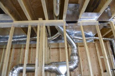 Despite radiant floor heating in this home, ducting was required for ventilation. Bring the HPAC team in early means a simpler install