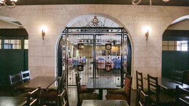 A replica of CFB Trenton's historic Queen's Gates divides the casual pub from the facility's banquet room. (photo: Nick Roy/Bryck Productions)